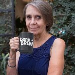 15oz-mug-mockup-of-an-elderly-woman-drinking-coffee-in-her-backyard-27436
